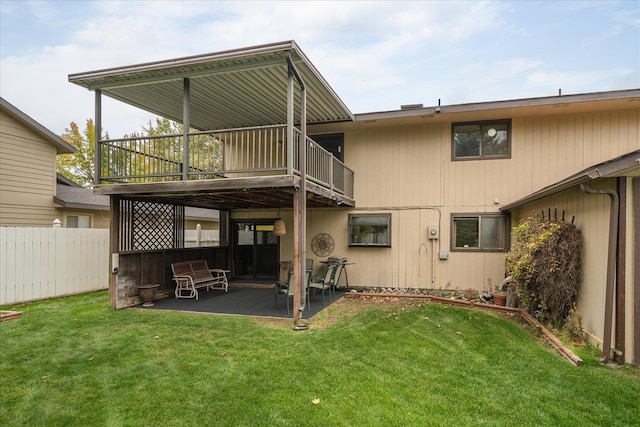 back of house featuring a yard and a patio area