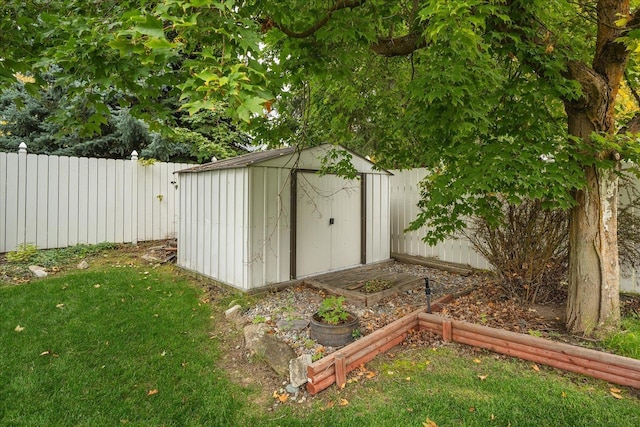 view of outbuilding featuring a yard