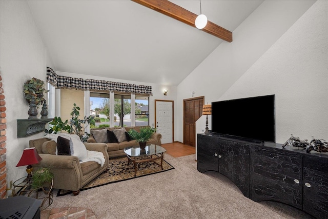 living room featuring beam ceiling, light carpet, and high vaulted ceiling