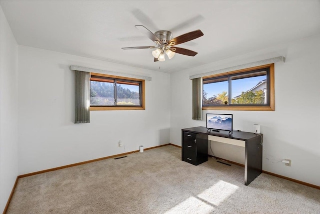 unfurnished office with light carpet and ceiling fan