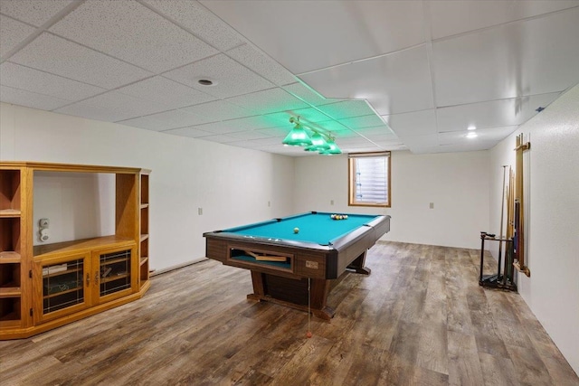 rec room with a paneled ceiling, wood-type flooring, and pool table