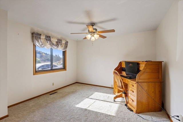 unfurnished office with light carpet and ceiling fan