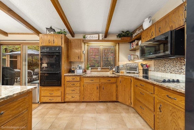 kitchen with decorative backsplash, beamed ceiling, black appliances, light stone counters, and a textured ceiling