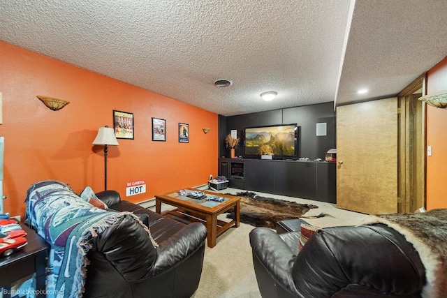 carpeted home theater with a textured ceiling