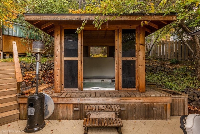 deck with a patio and a jacuzzi