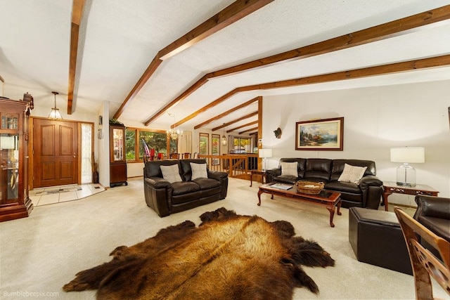 living room featuring vaulted ceiling with beams, an inviting chandelier, and light carpet