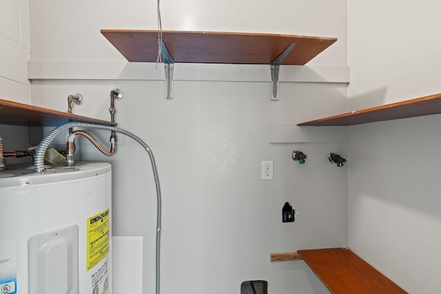 utility room featuring water heater