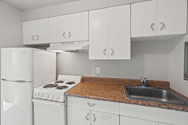 kitchen featuring white cabinetry, sink, and white appliances