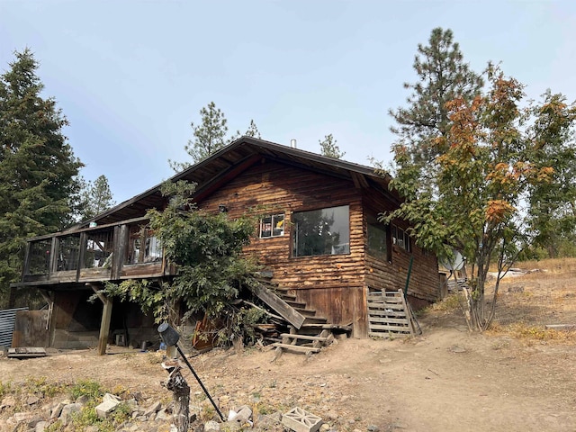 view of property exterior featuring a deck