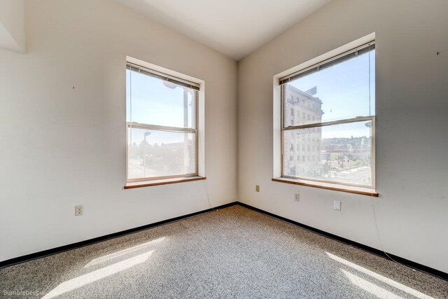 unfurnished room with carpet flooring