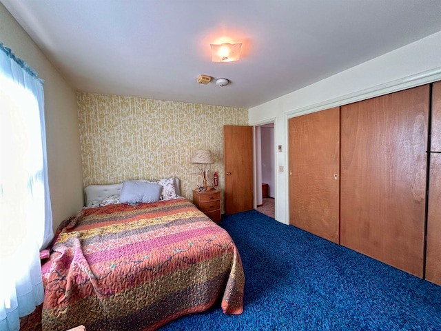 carpeted bedroom featuring a closet