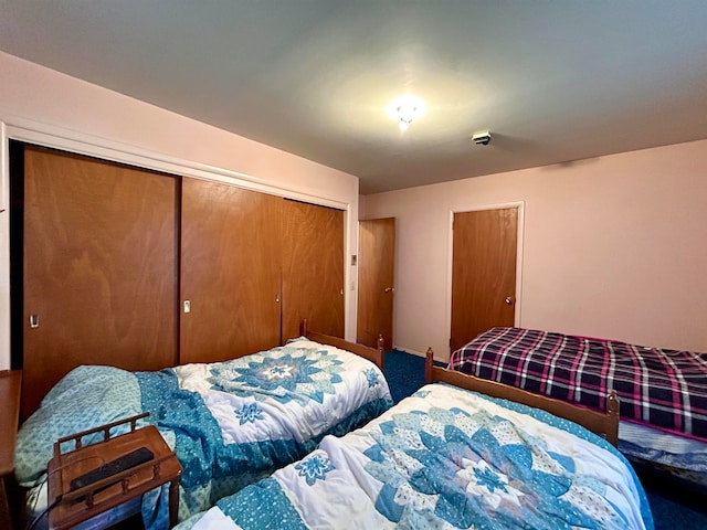 bedroom featuring a closet and carpet