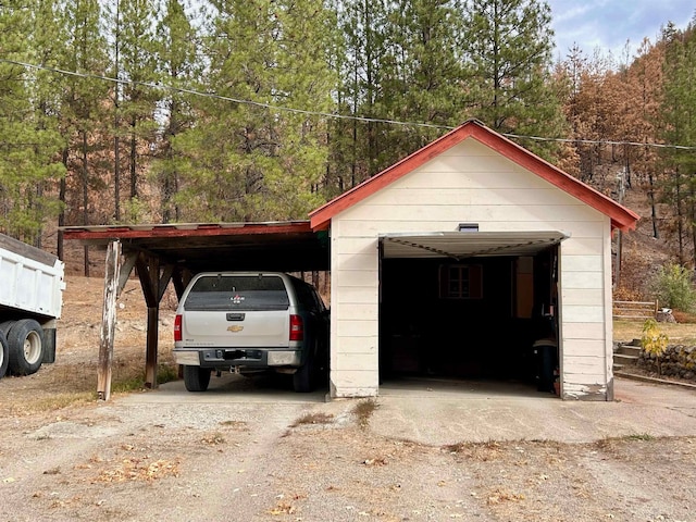 garage featuring a carport