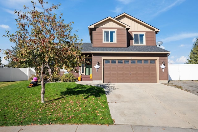 view of front of property with a front lawn and a garage