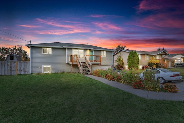 view of front of property with a yard