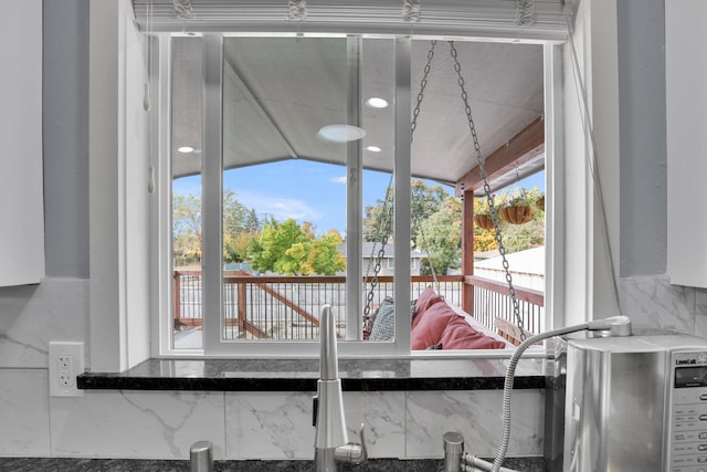 sunroom / solarium featuring a healthy amount of sunlight