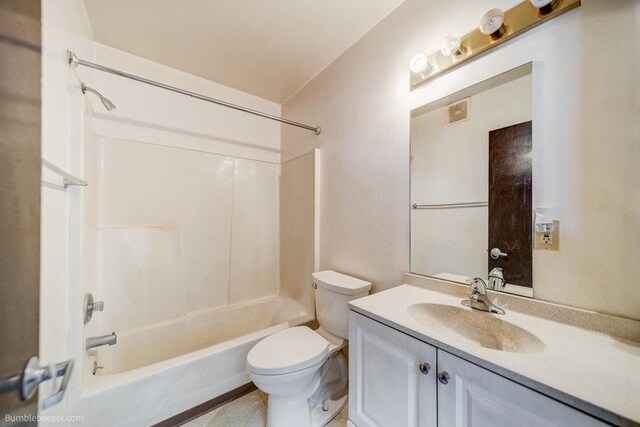 full bathroom featuring toilet, vanity, and shower / bathtub combination