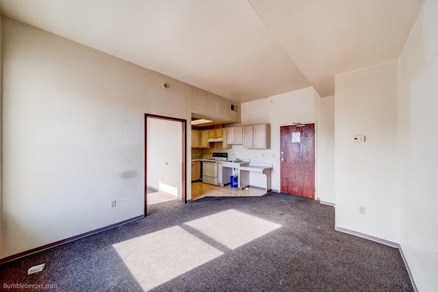 unfurnished living room with light colored carpet