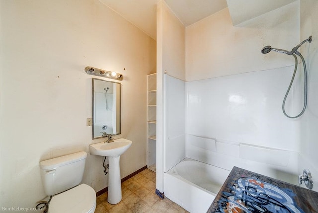 bathroom featuring bathtub / shower combination and toilet