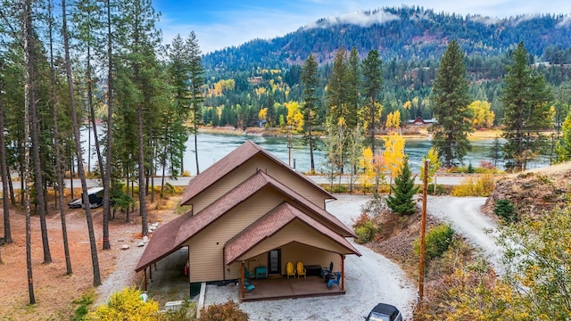 surrounding community featuring a water and mountain view