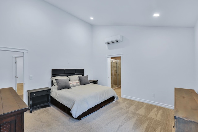 carpeted bedroom featuring ensuite bath, high vaulted ceiling, and a wall mounted AC