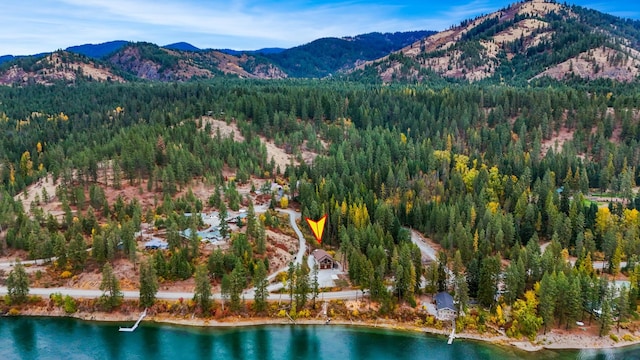 drone / aerial view featuring a water and mountain view