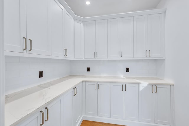 laundry room featuring light hardwood / wood-style flooring