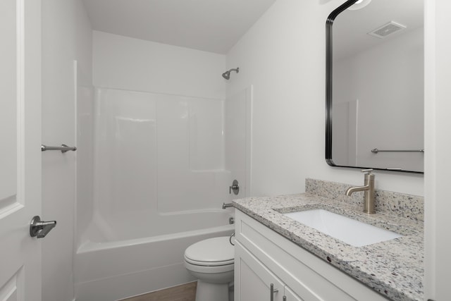 bathroom featuring vanity, toilet, shower / washtub combination, wood finished floors, and visible vents