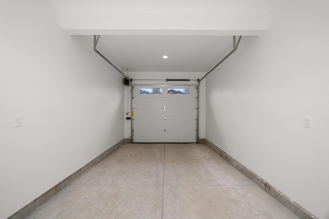 garage with baseboards and recessed lighting