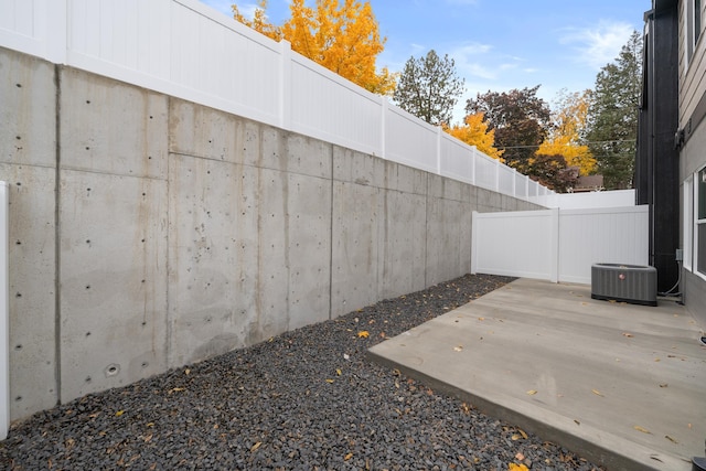 view of patio featuring fence and cooling unit
