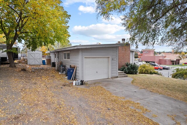 exterior space with a shed