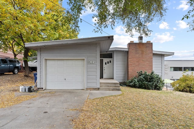 302 N Argonne Rd, Spokane Valley, WA 99212 - view of front of home featuring an attached garage and driveway