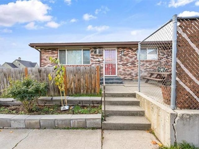 711 E Broad Avenue 715E Broad Ave, Spokane, WA 99207 - view of front of property with brick siding and fence