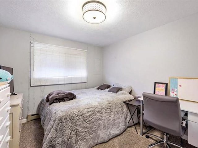 carpeted bedroom with a textured ceiling