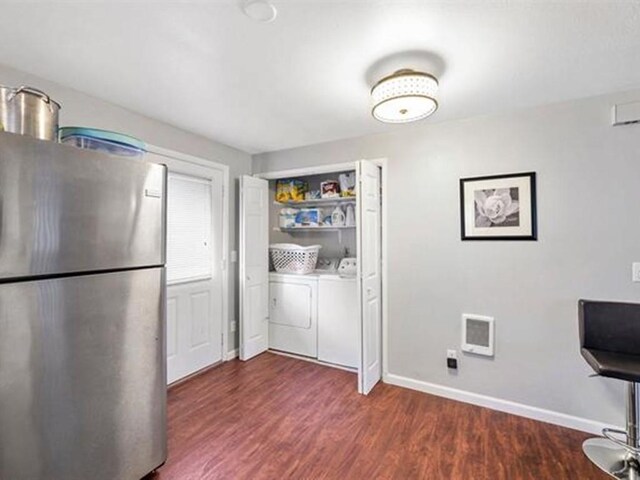711 E Broad Avenue 715E Broad Ave, Spokane, WA 99207 - interior space featuring freestanding refrigerator, wood finished floors, independent washer and dryer, and baseboards