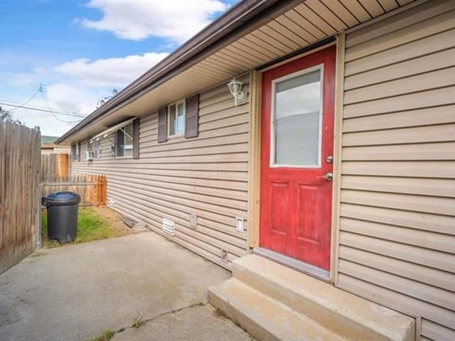 711 E Broad Avenue 715E Broad Ave, Spokane, WA 99207 - view of exterior entry featuring fence and a patio area