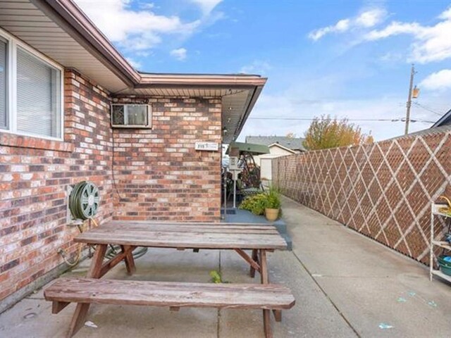 711 E Broad Avenue 715E Broad Ave, Spokane, WA 99207 - view of patio with outdoor dining space and fence