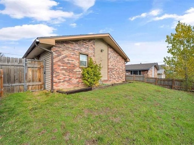 view of home's exterior with a lawn