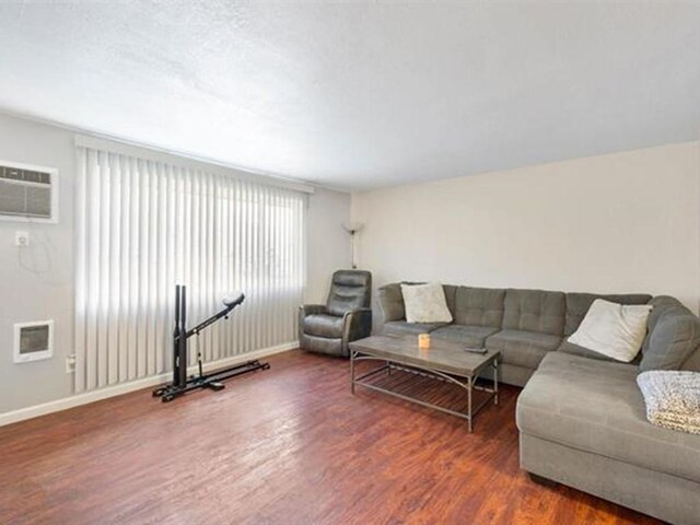 living room featuring dark hardwood / wood-style floors