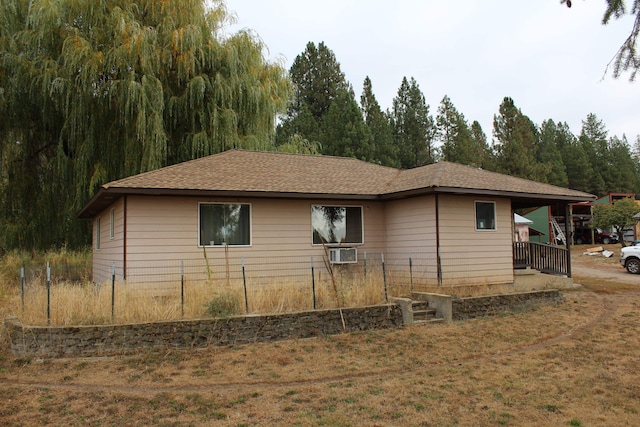 view of side of property featuring cooling unit