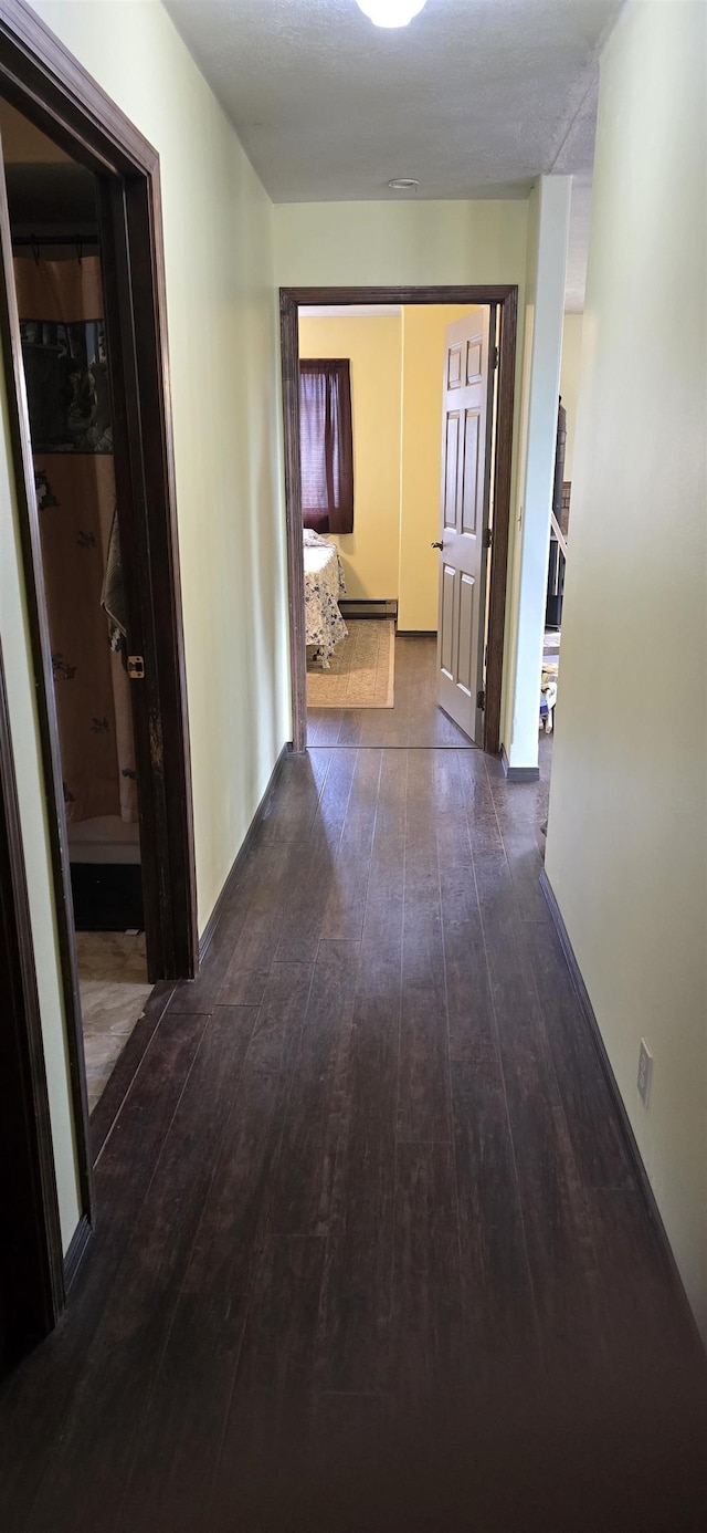 corridor with dark wood-type flooring