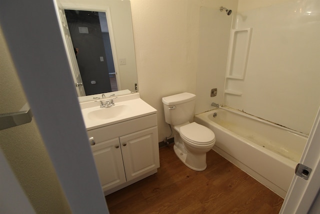 full bathroom featuring vanity, toilet, shower / bathing tub combination, and hardwood / wood-style floors