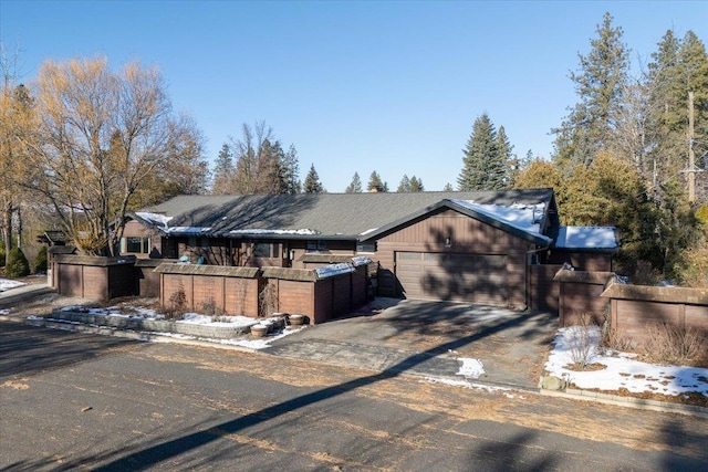 ranch-style house featuring a garage