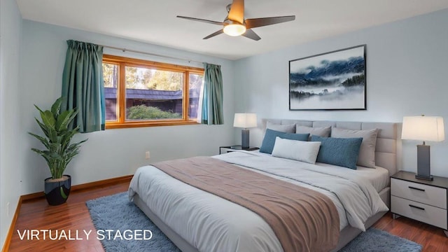 bedroom with dark hardwood / wood-style floors and ceiling fan