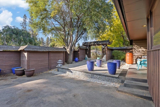 view of patio / terrace with a storage unit