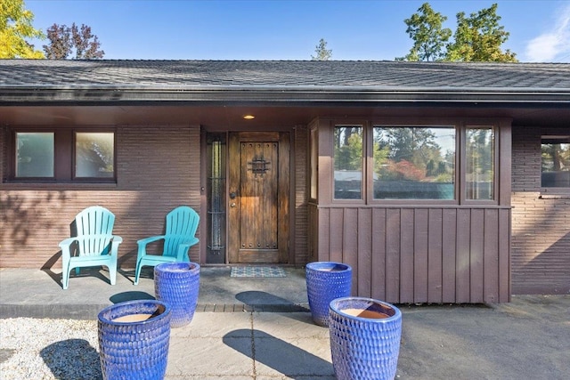 entrance to property featuring a patio