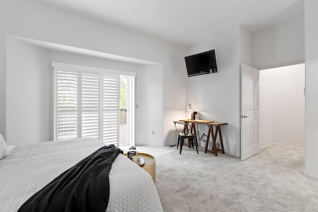 bedroom featuring light carpet