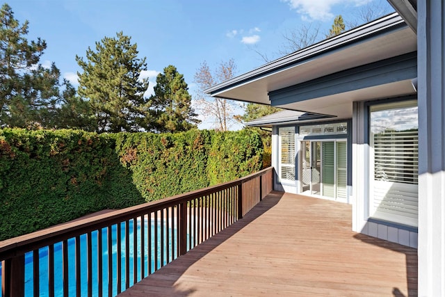 deck featuring a pool