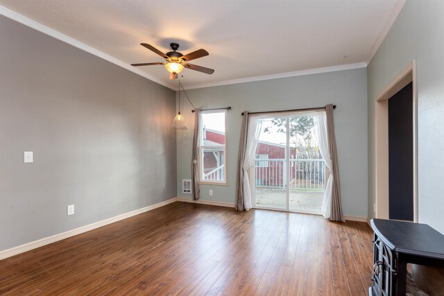 spare room featuring crown molding, hardwood / wood-style flooring, and ceiling fan