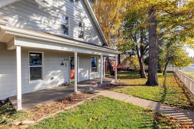 view of front of home featuring a front yard and a porch